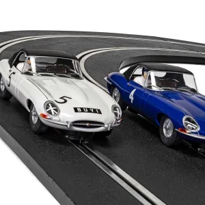 Jaguar E-Type First Race Win 1961 - Twin Pack - Limited Edition This Limited Edition 1961 Jaguar E-Type Scalextric Slot Car Twin Pack is a fitting tribute to the first race and first race win for the iconic Jaguar E-Type! A great performance by both drivers saw the racing career of the legendary E-Type get off to a fantastic start with Graham Hill winning the 25-lap race and Roy Salvadori bringing it home in an impressive third place