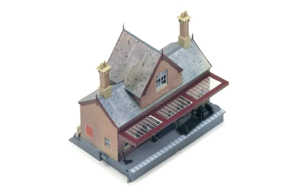 Booking Hall No train station is ever complete without a booking hall! If you are yet to add one into your layout then this is just the one waiting to be brought home today. Why not add some people figurines into the scene to bring this bustling booking stall to life?